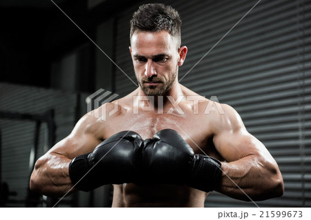 Angry shirtless man with boxe gloves 21599673
