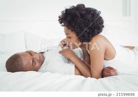 Happy couple lying on the bed 21599698