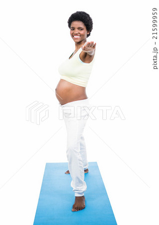 Pregnant woman doing yoga exercise Pregnant woman doing yoga exercise 21599959