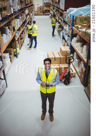 Warehouse worker using hand scanner Warehouse worker using hand scanner 21601390