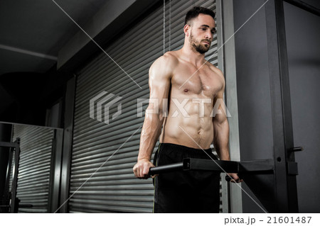 Shirtless man doing pull up Shirtless man doing pull up 21601487