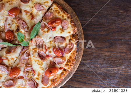 spicy sausage pizza on wooden table, Top view 21604023