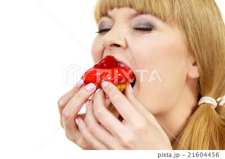 Woman eating cupcake sweet food Woman eating cupcake sweet food 21604456