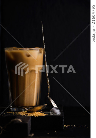 Iced coffee with milk in a tall glass, black Iced coffee with milk in a tall glass, black 21604795