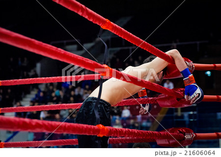 MMA fighter on ropes of the ring 21606064