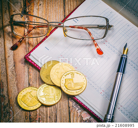 Coins and pen, business Coins and pen, business 21608995