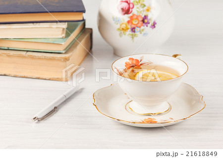 Tea with lemon and books on the table Tea with lemon and books on the table 21618849