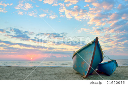 sunrise over an  wooden fishing boats 21620056