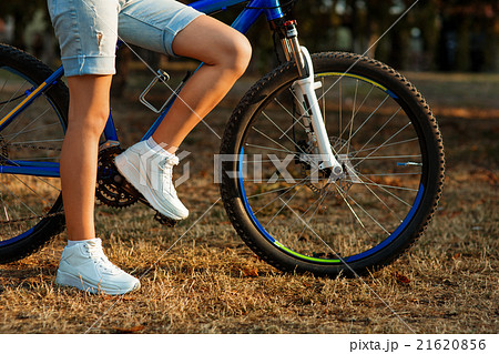 teenage girl with bike in the city park teenage girl with bike in the city park 21620856