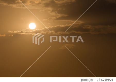 orange sky with sun and black clouds 21620954