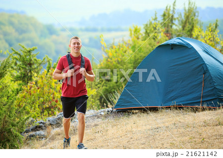 Men walk along the hill with backpack Men walk along the hill with backpack 21621142