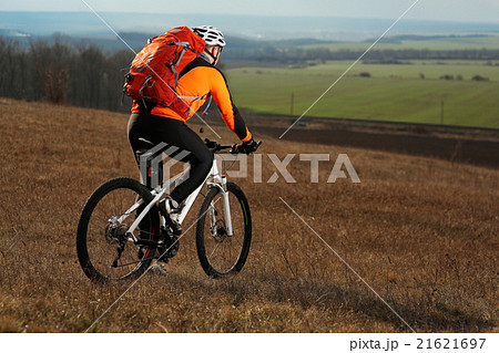 Man cyclist with backpack riding the bicycle 21621697