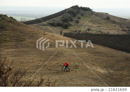 Man cyclist with backpack riding the bicycle 21621699