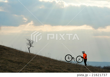Man cyclist with backpack riding the bicycle 21621737