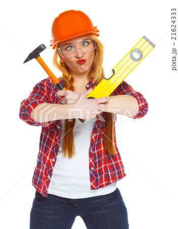 Funny woman in helmet with the work tools on white Funny woman in helmet with the work tools on white 21624333