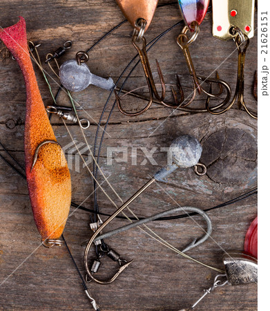 fishing tackles and spoon on wooden fishing tackles and spoon on wooden 21626151