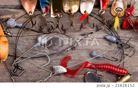 fishing tackles and spoon on wooden fishing tackles and spoon on wooden 21626152