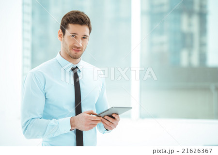 Young businessman in office with big window 21626367