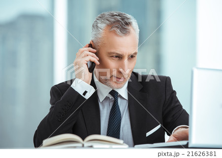 Aged businessman in office with big window 21626381