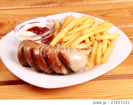 grilled sausages with French fries and ketchup grilled sausages with French fries and ketchup 21637122