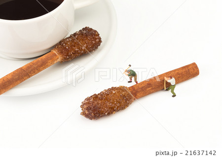 coffee cup with brown sugar on cinnamon stick 21637142