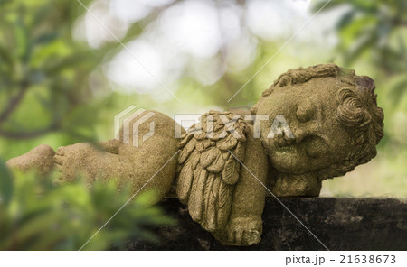 Old baby cupid in the garden 21638673