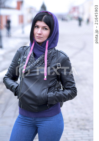 Outdoors beautiful young brunette woman posing in Outdoors beautiful young brunette woman posing in 21645903