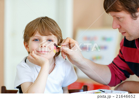 Dad painting flag on face of little kid for Dad painting flag on face of little kid for 21646652