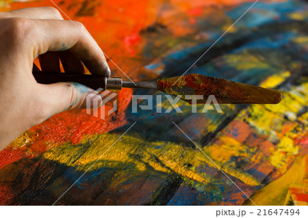 Abstract painted canvas. Oil paints on a palette. 21647494