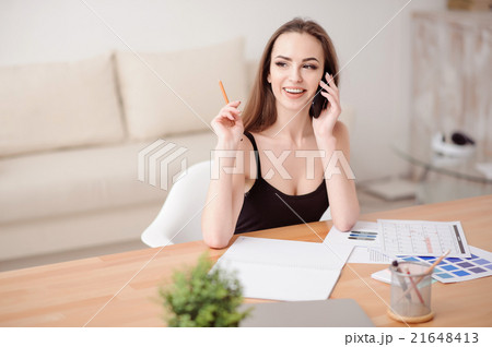 Cheerful girl talking on cell phone  21648413