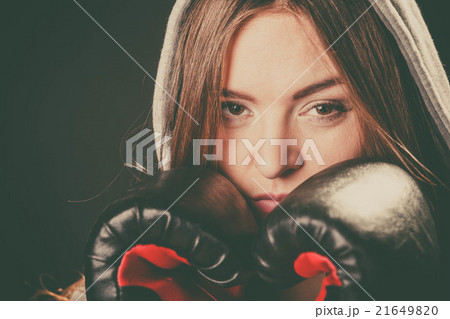 Woman cover face with boxing gloves. Woman cover face with boxing gloves. 21649820