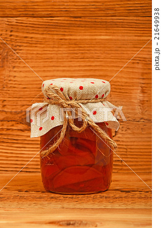 One jar of quince jam at vintage wood One jar of quince jam at vintage wood 21649938