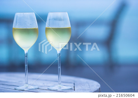 Two glasses of tasty white wine at sunset  21650604