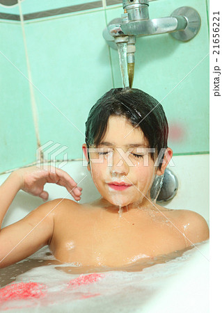 handsome boy wash his head with shampoo handsome boy wash his head with shampoo 21656221