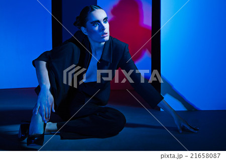 Fashion Portrait of woman over colorful background 21658087