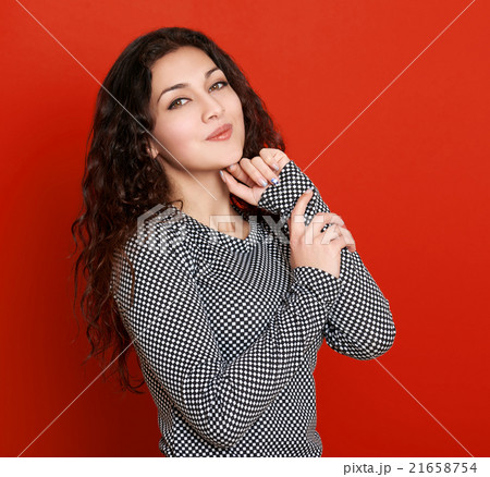girl glamour portrait on red, long curly hair girl glamour portrait on red, long curly hair 21658754