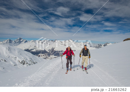 Two elderly men practice ski mountaineering 21663262