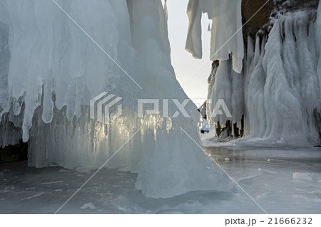 Huge icicles on rocks. 21666232