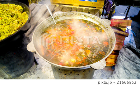 soup boiling in big metal pan on fire soup boiling in big metal pan on fire 21666852
