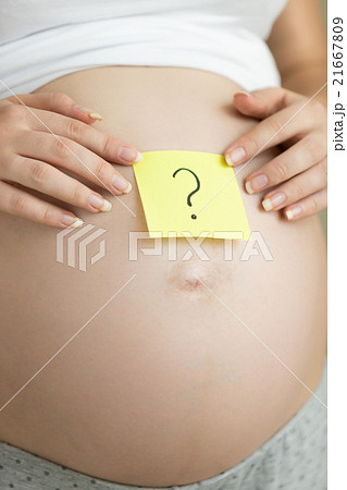 pregnant woman holding question mark on sticker pregnant woman holding question mark on sticker 21667809