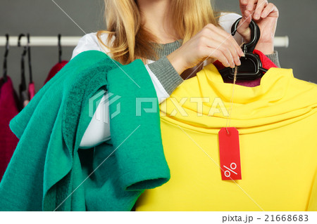 Woman holding discount label. Sale and retail. 21668683