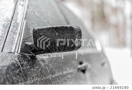 Freezing rain, ice coated black car in winter. 21669280
