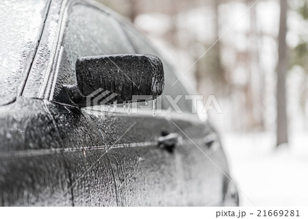 Freezing rain, ice coated black car in winter. Freezing rain, ice coated black car in winter. 21669281