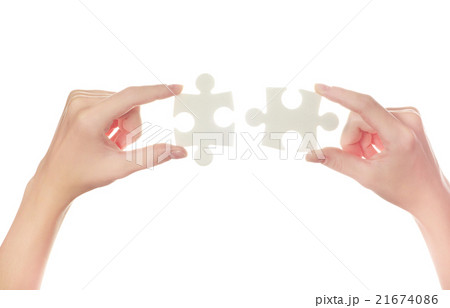 puzzle in hand isolated on white background 21674086