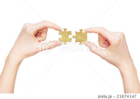 puzzle in hand isolated on white background 21674147
