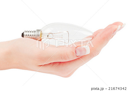 Lit lightbulb held in hand 21674342