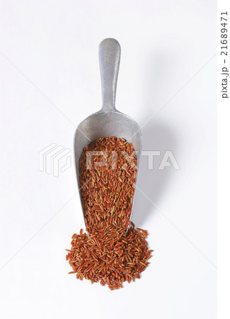 Scoop of red rice 21689471