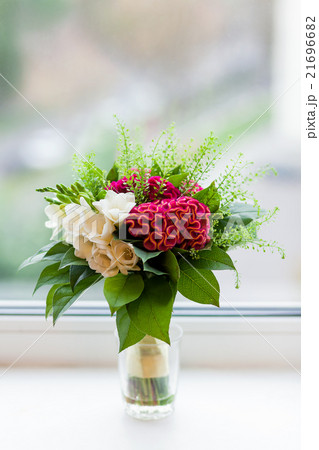 Wedding bouquet on window sill. Wedding bouquet on window sill. 21696682