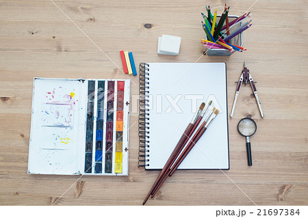 Workplace artist top view. Paint, brushes spread Workplace artist top view. Paint, brushes spread 21697384