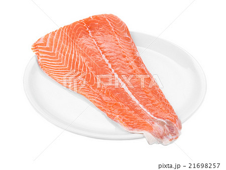 Raw salmon fillet on plate. 21698257